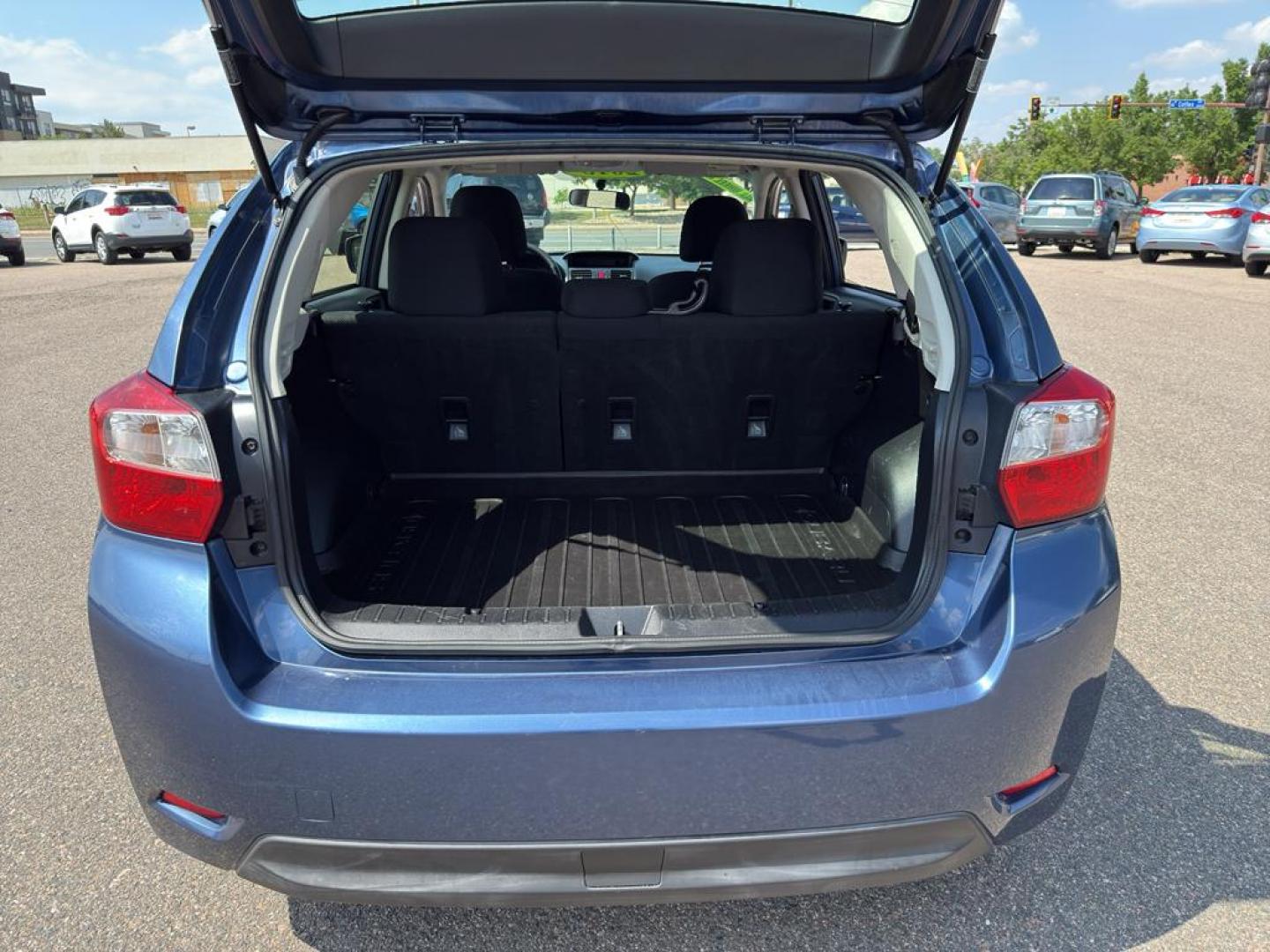 2013 BLUE Subaru Impreza Premium AWP (JF1GPAC66D2) with an 4 Cyl, 2.0L engine, Automatic transmission, located at 10890 W. Colfax Ave., Lakewood, CO, 80215, (303) 274-7692, 39.739914, -105.120132 - Photo#12