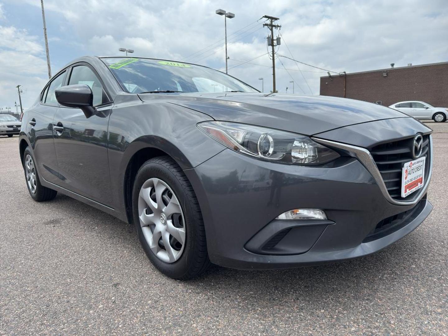 2014 GREEN Mazda Mazda3 i Sport w/SKYACTIV-G (JM1BM1U71E1) with an 4 Cyl, 2.0L engine, Automatic transmission, located at 10890 W. Colfax Ave., Lakewood, CO, 80215, (303) 274-7692, 39.739914, -105.120132 - Introducing the 2014 Mazda Mazda3 i Sport, a superb blend of style, efficiency, and performance that suits both urban and highway driving. This compact sedan is powered by a responsive 2.0L 4-cylinder SKYACTIV-G engine, delivering an impressive balance of power and fuel efficiency. The front-wheel-d - Photo#2