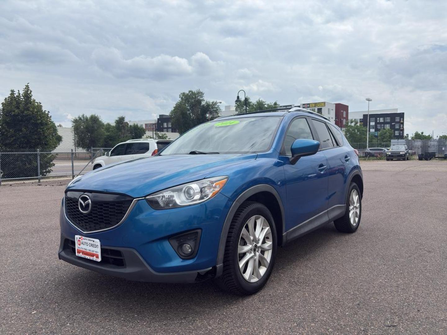 2014 BLUE Mazda CX-5 Grand Touring (JM3KE4DY6E0) with an 4 Cyl, 2.5L engine, Automatic transmission, located at 10890 W. Colfax Ave., Lakewood, CO, 80215, (303) 274-7692, 39.739914, -105.120132 - Photo#0