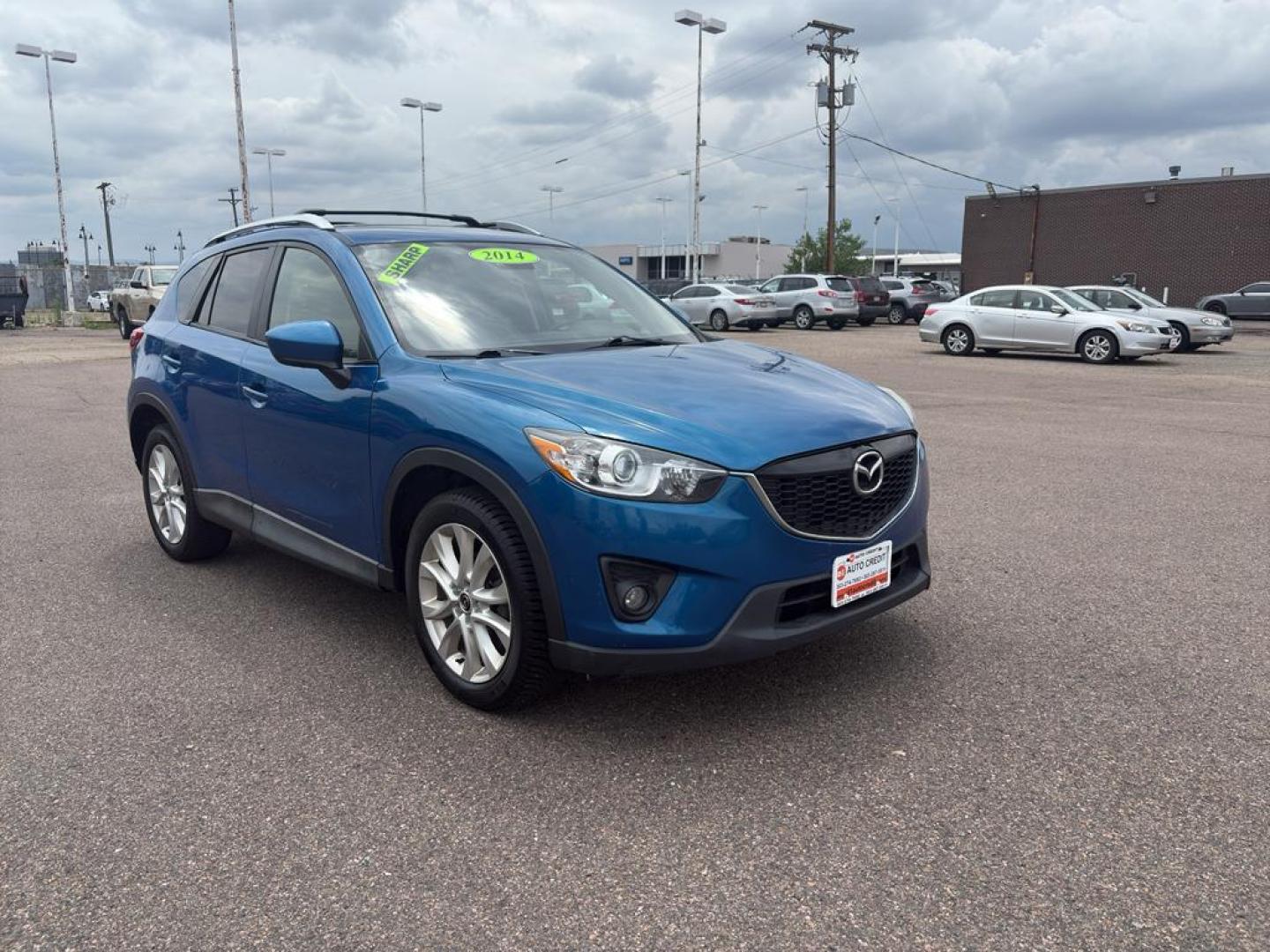 2014 BLUE Mazda CX-5 Grand Touring (JM3KE4DY6E0) with an 4 Cyl, 2.5L engine, Automatic transmission, located at 10890 W. Colfax Ave., Lakewood, CO, 80215, (303) 274-7692, 39.739914, -105.120132 - Photo#2