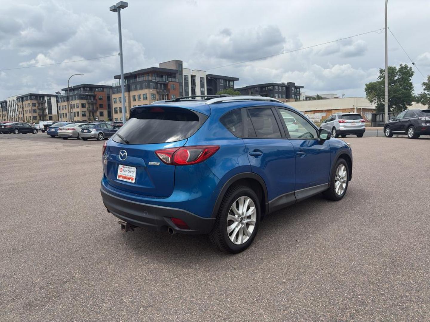 2014 BLUE Mazda CX-5 Grand Touring (JM3KE4DY6E0) with an 4 Cyl, 2.5L engine, Automatic transmission, located at 10890 W. Colfax Ave., Lakewood, CO, 80215, (303) 274-7692, 39.739914, -105.120132 - Photo#4