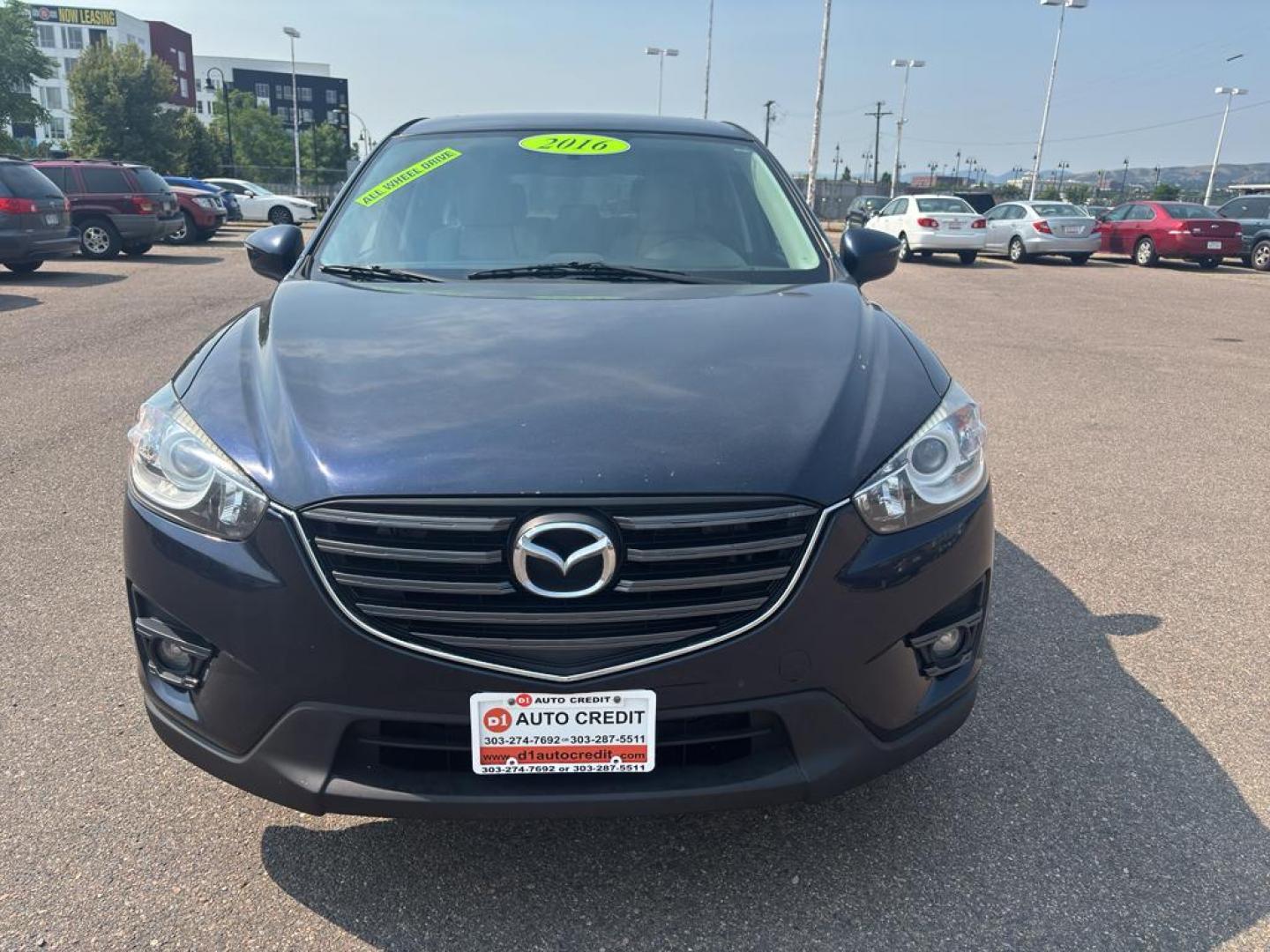 2016 BLUE Mazda CX-5 Touring (JM3KE4CY5G0) with an 4 Cyl, 2.5L engine, Automatic transmission, located at 10890 W. Colfax Ave., Lakewood, CO, 80215, (303) 274-7692, 39.739914, -105.120132 - Photo#1