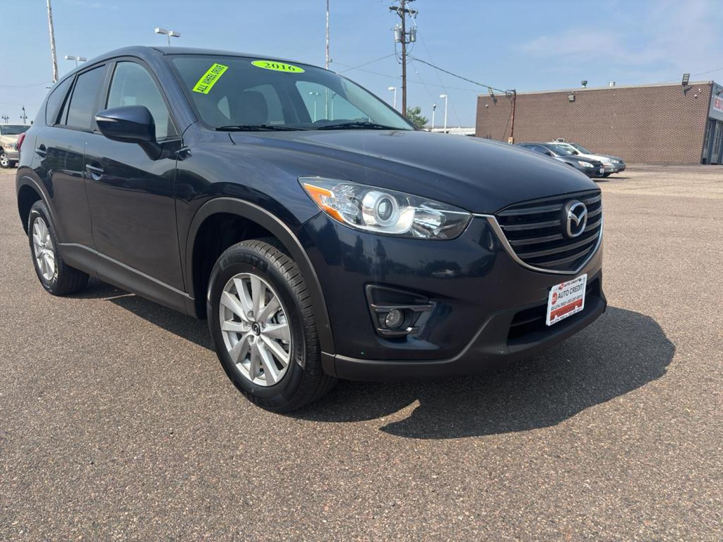 2016 BLUE Mazda CX-5 Touring (JM3KE4CY5G0) with an 4 Cyl, 2.5L engine, Automatic transmission, located at 10890 W. Colfax Ave., Lakewood, CO, 80215, (303) 274-7692, 39.739914, -105.120132 - Photo#2