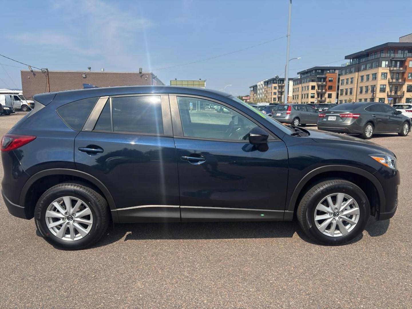 2016 BLUE Mazda CX-5 Touring (JM3KE4CY5G0) with an 4 Cyl, 2.5L engine, Automatic transmission, located at 10890 W. Colfax Ave., Lakewood, CO, 80215, (303) 274-7692, 39.739914, -105.120132 - Photo#3
