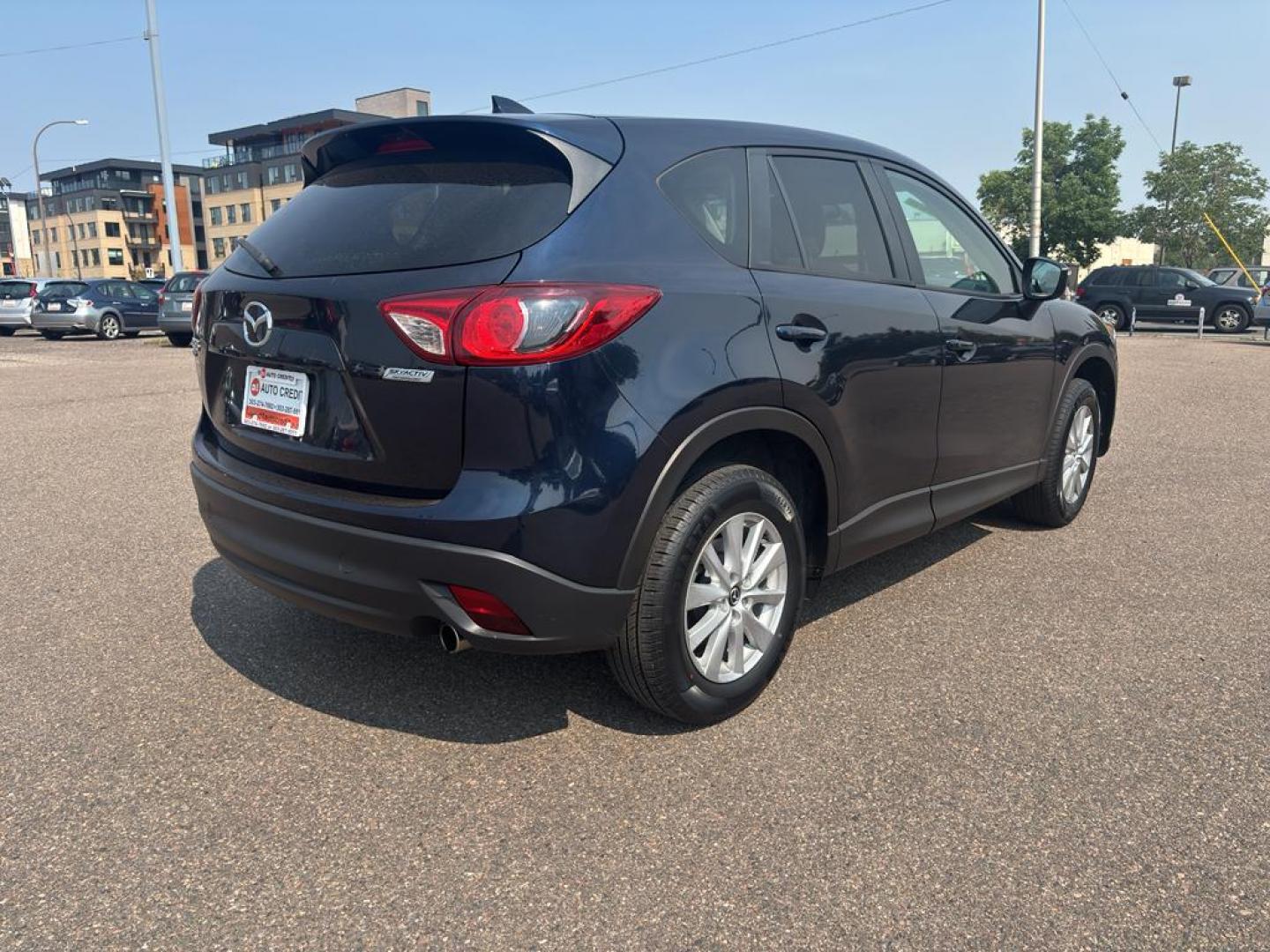 2016 BLUE Mazda CX-5 Touring (JM3KE4CY5G0) with an 4 Cyl, 2.5L engine, Automatic transmission, located at 10890 W. Colfax Ave., Lakewood, CO, 80215, (303) 274-7692, 39.739914, -105.120132 - Photo#4