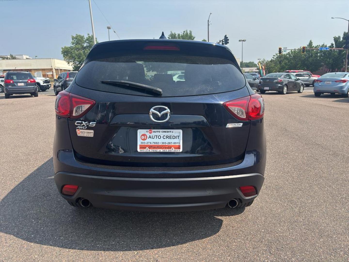 2016 BLUE Mazda CX-5 Touring (JM3KE4CY5G0) with an 4 Cyl, 2.5L engine, Automatic transmission, located at 10890 W. Colfax Ave., Lakewood, CO, 80215, (303) 274-7692, 39.739914, -105.120132 - Photo#5