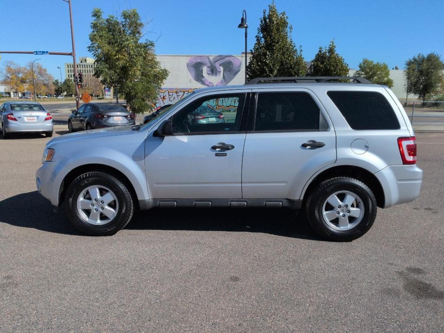 2010 SILVER Ford Escape XLT (1FMCU9D71AK) with an 4 Cyl, 2.5L engine, Automatic transmission, located at 10890 W. Colfax Ave., Lakewood, CO, 80215, (303) 274-7692, 39.739914, -105.120132 - Photo#7