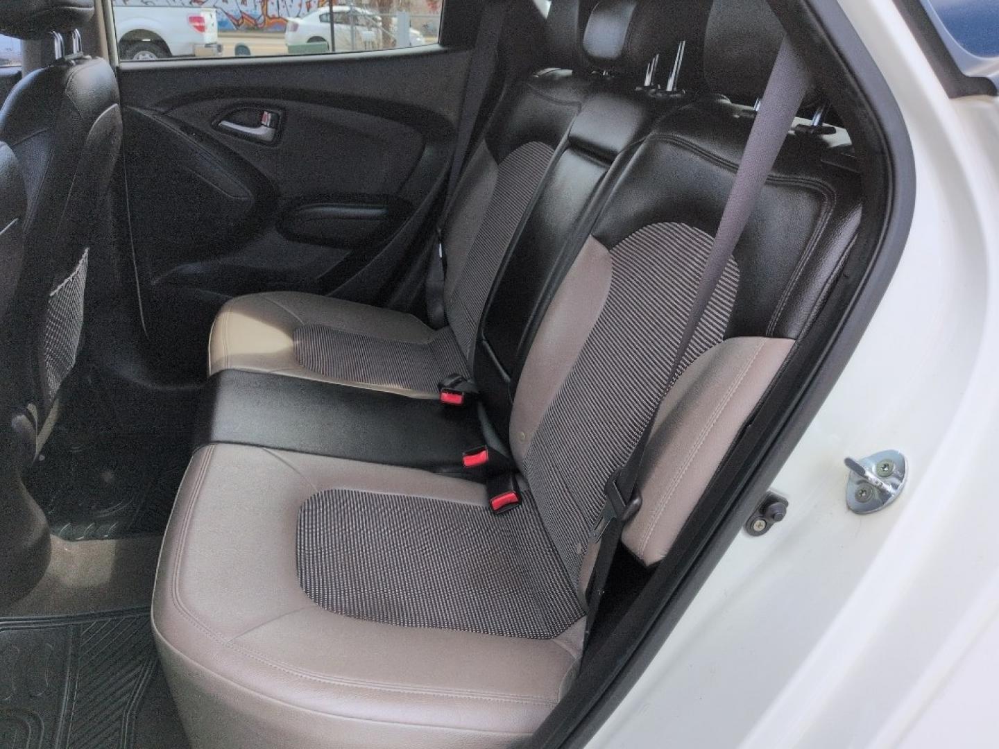 2011 WHITE Hyundai Tucson LIMITED AUTO AWD (KM8JUCAC4BU) with an 4 Cyl, 2.4L engine, Automatic transmission, located at 10890 W. Colfax Ave., Lakewood, CO, 80215, (303) 274-7692, 39.739914, -105.120132 - Photo#16