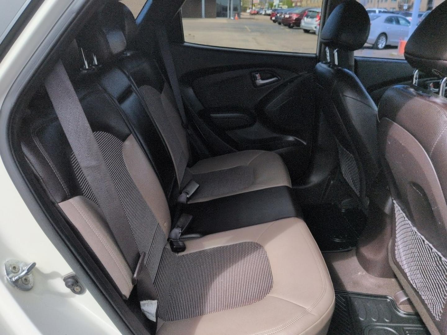 2011 WHITE Hyundai Tucson LIMITED AUTO AWD (KM8JUCAC4BU) with an 4 Cyl, 2.4L engine, Automatic transmission, located at 10890 W. Colfax Ave., Lakewood, CO, 80215, (303) 274-7692, 39.739914, -105.120132 - Photo#20