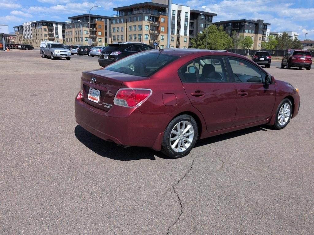 2014 RED Subaru Impreza Premium AWP (JF1GJAC60EH) with an 4 Cyl, 2.0L engine, Automatic transmission, located at 10890 W. Colfax Ave., Lakewood, CO, 80215, (303) 274-7692, 39.739914, -105.120132 - Photo#4