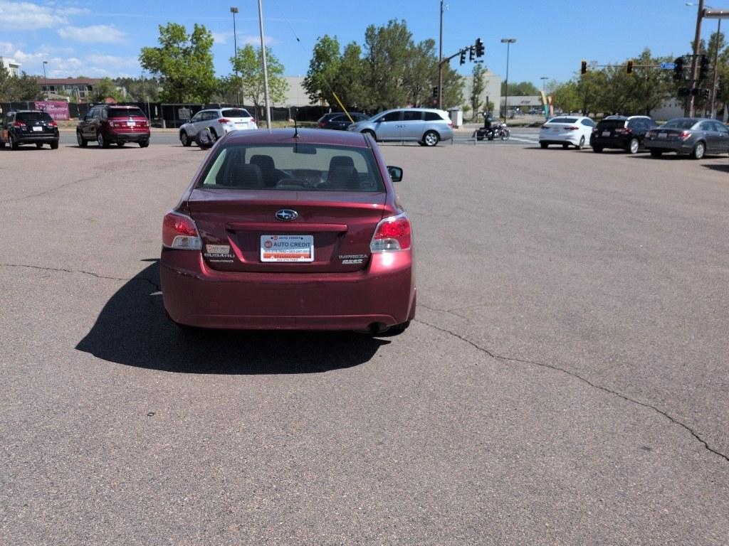 2014 RED Subaru Impreza Premium AWP (JF1GJAC60EH) with an 4 Cyl, 2.0L engine, Automatic transmission, located at 10890 W. Colfax Ave., Lakewood, CO, 80215, (303) 274-7692, 39.739914, -105.120132 - Photo#5