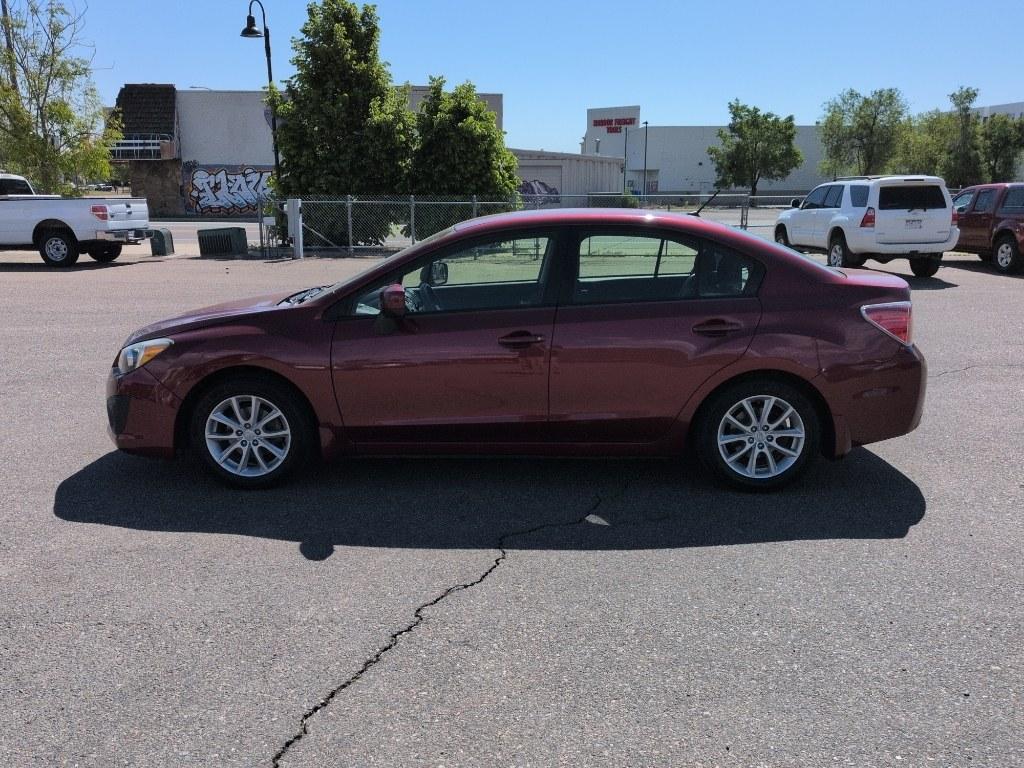 2014 RED Subaru Impreza Premium AWP (JF1GJAC60EH) with an 4 Cyl, 2.0L engine, Automatic transmission, located at 10890 W. Colfax Ave., Lakewood, CO, 80215, (303) 274-7692, 39.739914, -105.120132 - Photo#7