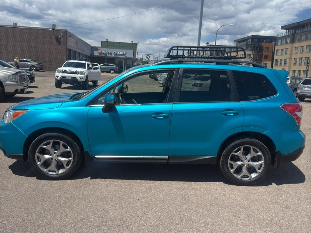 2015 SILVER Subaru Forester 2.5i Touring (JF2SJAWC2FH) with an 4 Cyl, 2.5L engine, Automatic transmission, located at 10890 W. Colfax Ave., Lakewood, CO, 80215, (303) 274-7692, 39.739914, -105.120132- Photo#2