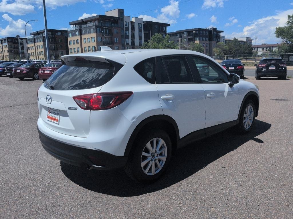 2014 WHITE Mazda CX-5 Touring (JM3KE2CY6E0) with an 4 Cyl, 2.5L engine, Automatic transmission, located at 10890 W. Colfax Ave., Lakewood, CO, 80215, (303) 274-7692, 39.739914, -105.120132- Photo#4