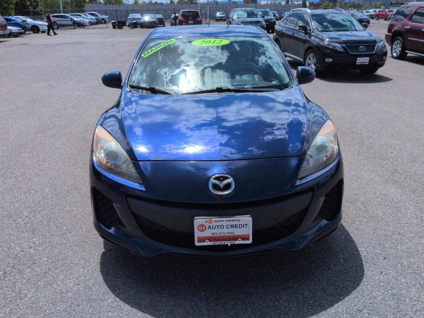2012 BLUE Mazda Mazda3 i Touring w/SKYACTIV-G (JM1BL1L72C1) with an 4 Cyl, 2.0L engine, Manual 6-Speed transmission, located at 10890 W. Colfax Ave., Lakewood, CO, 80215, (303) 274-7692, 39.739914, -105.120132- Photo#1