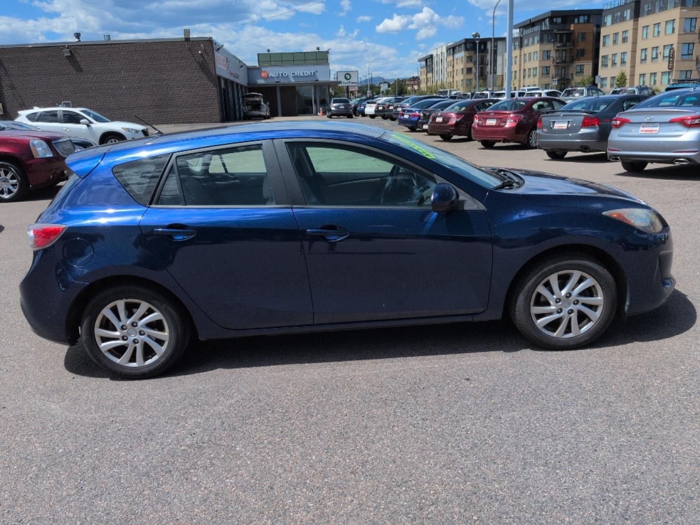 2012 BLUE Mazda Mazda3 i Touring w/SKYACTIV-G (JM1BL1L72C1) with an 4 Cyl, 2.0L engine, Manual 6-Speed transmission, located at 10890 W. Colfax Ave., Lakewood, CO, 80215, (303) 274-7692, 39.739914, -105.120132- Photo#3