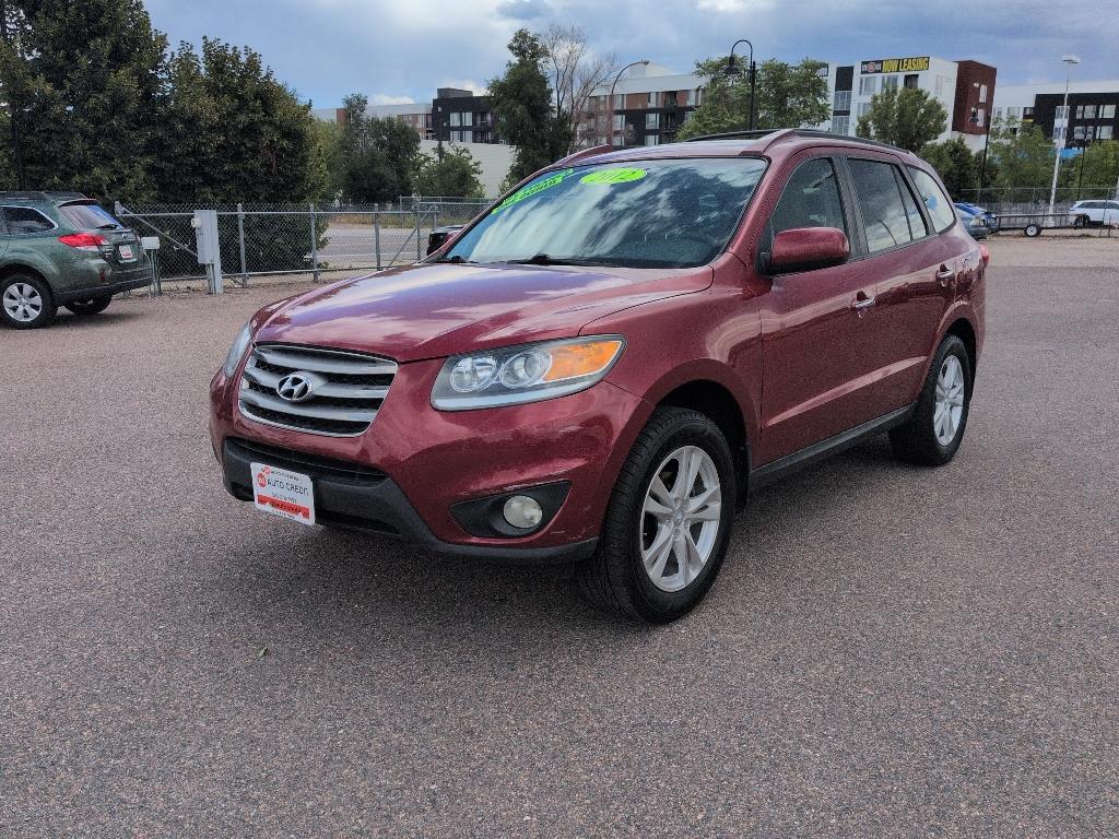 2012 red Hyundai Santa Fe LIMITED 3.5 FWD (5XYZK4AG3CG) with an V6, 3.5L engine, Automatic transmission, located at 10890 W. Colfax Ave., Lakewood, CO, 80215, (303) 274-7692, 39.739914, -105.120132- Photo#0